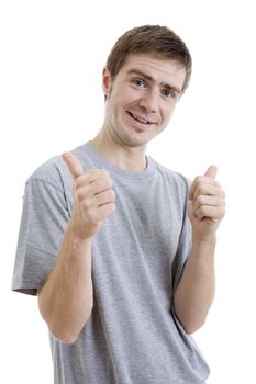 young casual man going thumb up, isolated on white