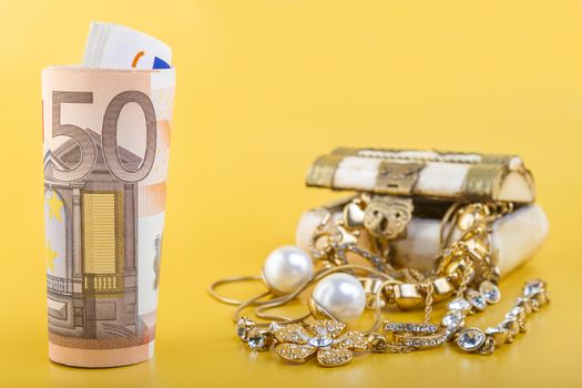 Cash for Gold Jewlery Concept - Concept or Metaphor for selling old gold jewelry for cash