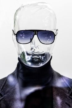 Male translucent mannequin in suit with sunglasses
