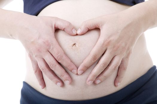 Closeup of pregnant woman at white background