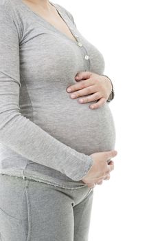 Closeup of pregnant woman at white background