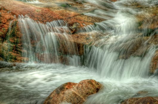 Detail of some cascade with mossy stones, horizontal