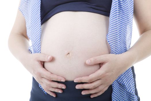 Closeup of pregnant woman at white background