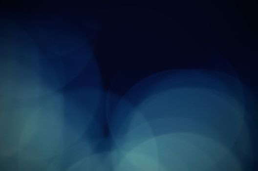 Blue circles in abstract shape, isolated on black background 