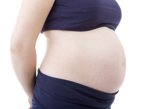 Closeup of pregnant woman at white background