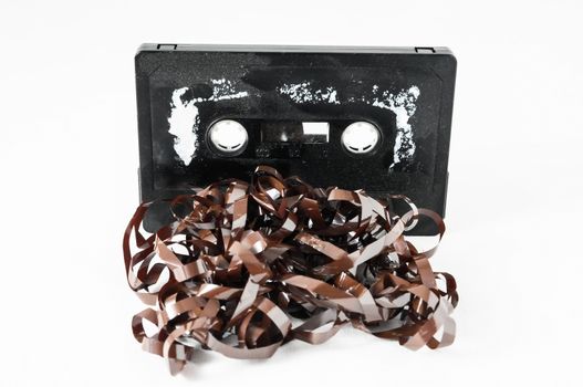 Ancient Vintage Used Musicassette over a White Background