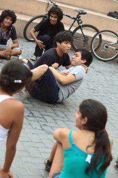 LIMA, PERU - MARCH 6, 2012: Unidentified young men playing improvisation in the amphitheatre of the Kennedy Park in Miraflores on March 6, 2012 in Lima, Peru. 