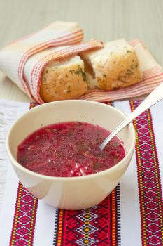 Traditional Ukrainian beetroot soup - red borsch and dumplings