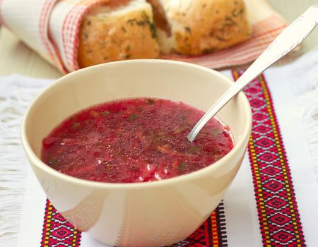 Traditional Ukrainian beetroot soup - red borsch and dumplings