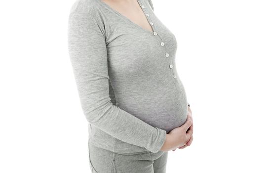 Closeup of pregnant woman at white background