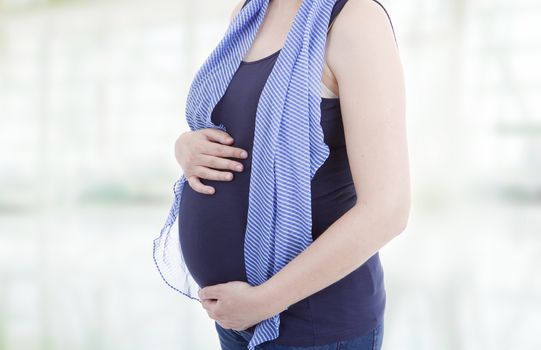 Closeup of unrecognizable pregnant woman