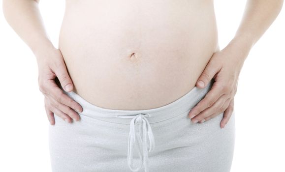 Closeup of pregnant woman at white background