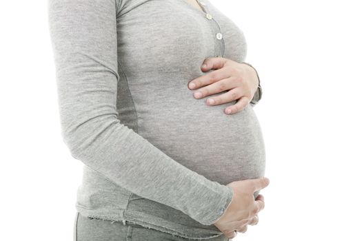 Closeup of pregnant woman at white background