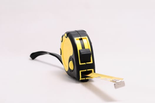 yellow tape measure isolated on white background