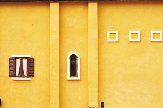 Retro wood window on brown concrete wall