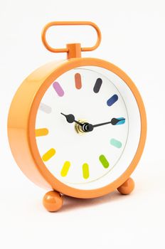 Orange Alarm Clock on a White Background