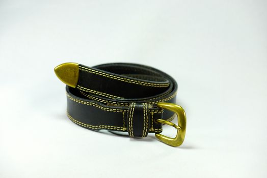 black leather belt on white scene,shallow focus