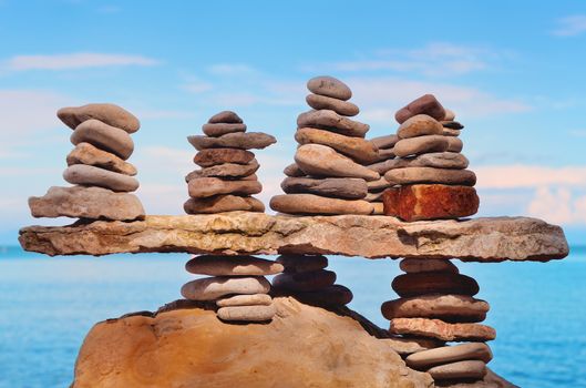 Piles of stones on the sea beach