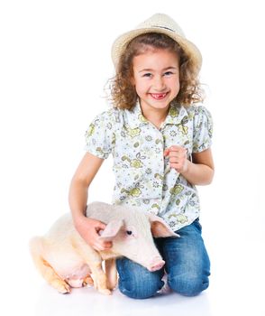 Little farmer. Cute girl with pig. Isolated on white background.