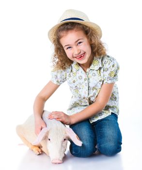 Little farmer. Cute girl with pig. Isolated on white background.