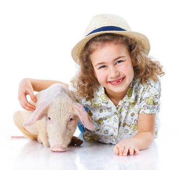 Little farmer. Cute girl with pig. Isolated on white background.