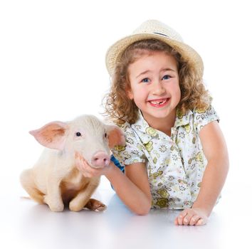 Little farmer. Cute girl with pig. Isolated on white background.