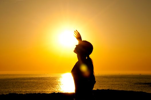 A beautiful girl silhouette free in the sun