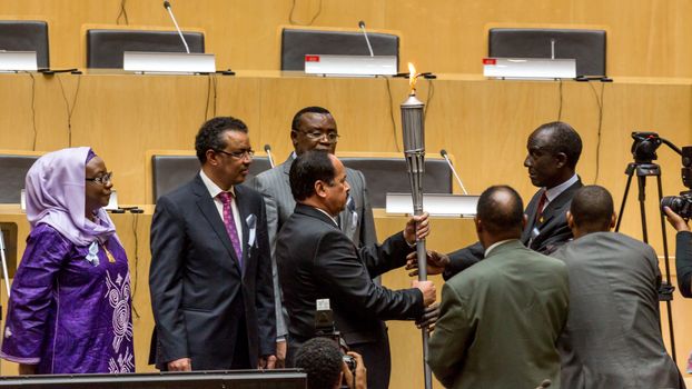 Addis Ababa, Ethiopia - April, 2014: Deans of the five regions of Africa exchange the "flame of remembrance" symbolizing memory, hope and preventing genocide, on 11 April, 2014, in Addis Ababa, Ethiopia