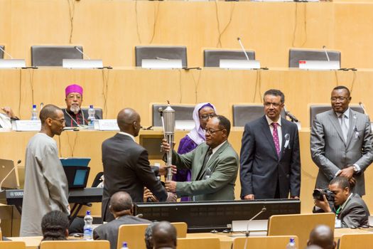 Addis Ababa, Ethiopia - April, 2014: Deans of the five regions of Africa exchange the "flame of remembrance" symbolizing memory, hope and preventing genocide, on 11 April, 2014, in Addis Ababa, Ethiopia