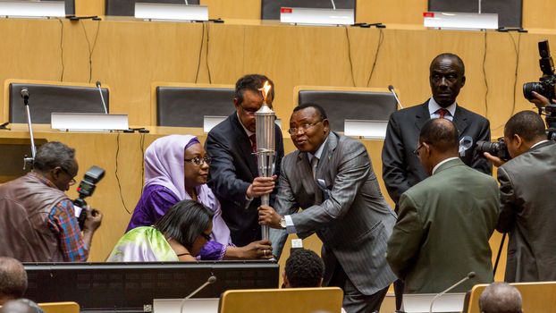 Addis Ababa, Ethiopia - April, 2014: Dr. Tedros, Adhanom, and Ambassador Nsengimana light the "flame of remembrance" which symbolizes memory, hope and preventing genocide, on 11 April, 2014, in Addis Ababa, Ethiopia