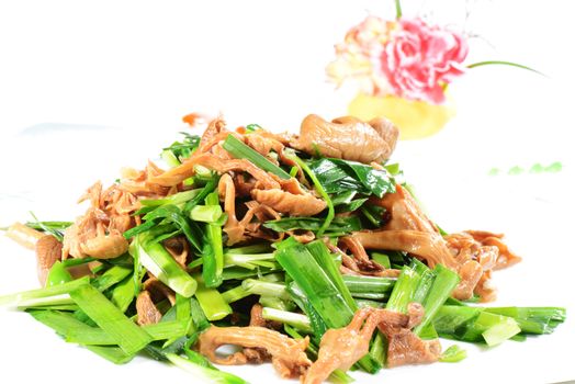 Chinese Food: Fried leek with mushroom in a white plate