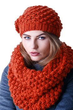 Young attractive Frenchwoman in knitted hat and scarf isolated on white background