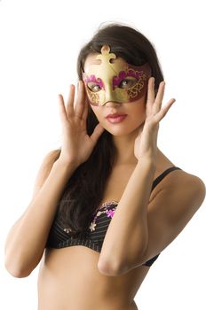 sensual young brunette in bra with a carnival mask