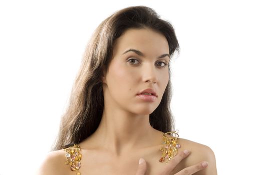 sensual brunette with golden earrings on shoulder