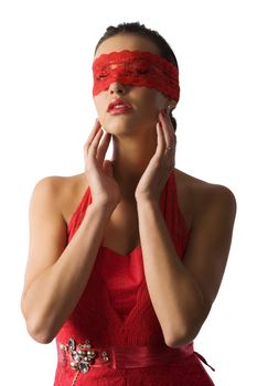 cute and sexy brunette in red shirt and a red lace mask looking up