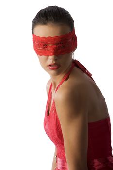 cute and sexy brunette in red shirt and a red lace mask looking up