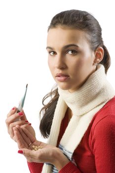 cute brunette in red pullover and white scarf with thermometer and pills looking sick
