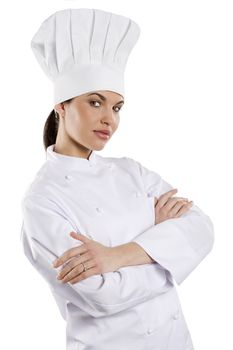 young graceful woman dressed as a cook with cap over white backgound