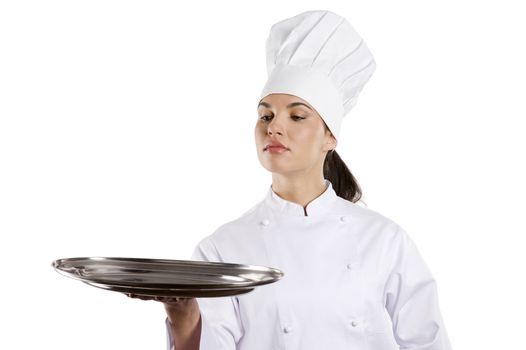 young graceful woman dressed as a cook with cap over white backgound with plate