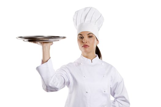 young graceful woman dressed as a cook with cap over white backgound with plate