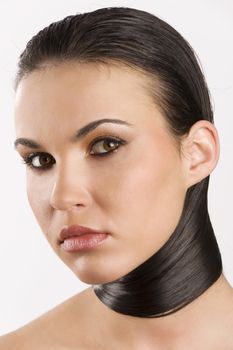 portrait of a young brunette with her long black hair around her neck