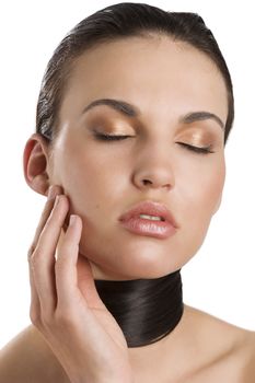 portrait of a young brunette with her long black hair around her neck keeping her eyes closed