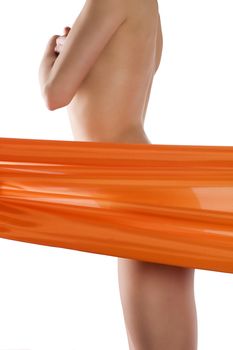 close up on a naked woman body behind a transparent orange colored material beauty wellness concept