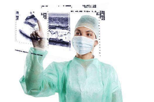 pretty nurse wearing a surgery dress with cap isolated over white touching a screen