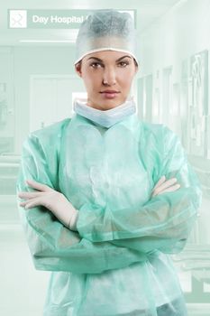 pretty nurse wearing a surgery dress with cap isolated over white