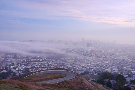 san francisco view with fog as seen from twin peak