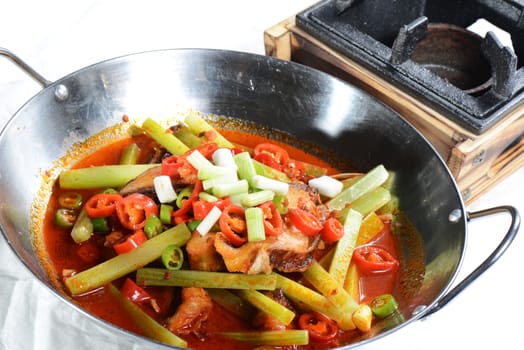 Chinese Food: Fried fish slices with pepper in a pot