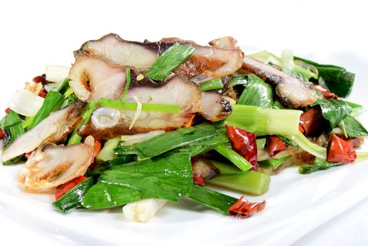 Chinese Food: Fried fish slices with leek and pepper