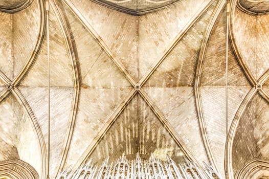 ornate brickwork architecture on an ancient cathedral ceiling