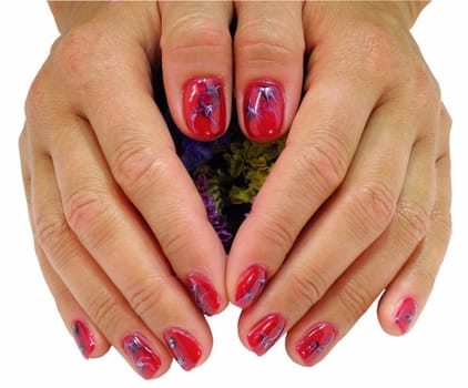 woman hands with red decorated nails on a white background 